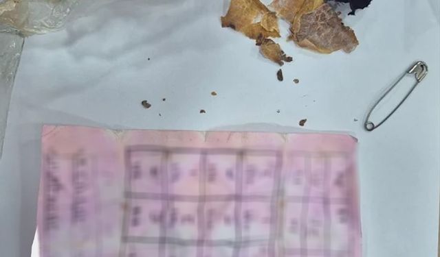 Bolu’da yapı marketin raflarının arasında muska çıktı: "Büyücülerin şerrinden Allah’a sığınırım"